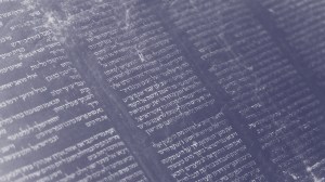 Open page of a handwritten Hebrew scripture with columns of text